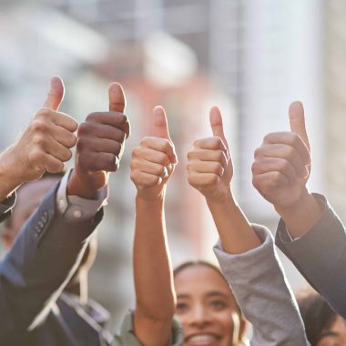 Our optimism is unbeatable. Shot of a group of businesspeople giving the thumbs up